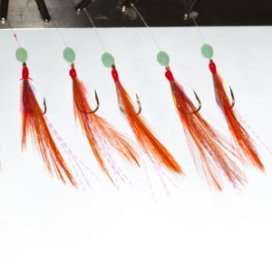 Hekle, rød med grønn perle